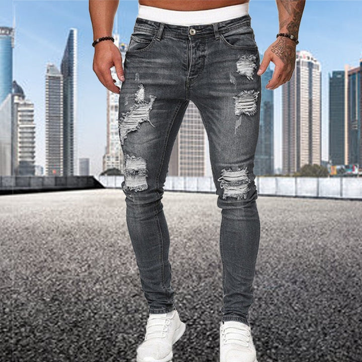 Trendy heren slim fit jeans met ripped details, perfect voor een comfortabele urban stijl.
