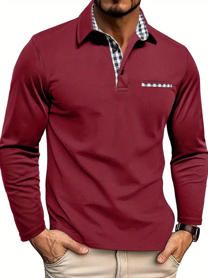 Elegante herenpolo met lange mouw en chique borstzak, perfect voor een stijlvolle mannenmode look.