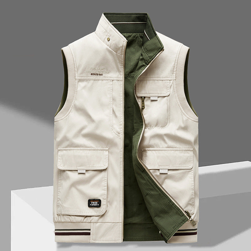 Omkeerbaar heren utilityvest met rits en handige zakken voor casual en outdoor gebruik.