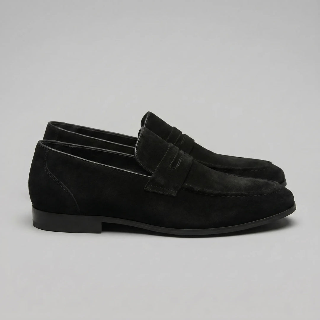 Casual zwarte penny loafers voor heren, veelzijdig en comfortabel, de perfecte instapper.