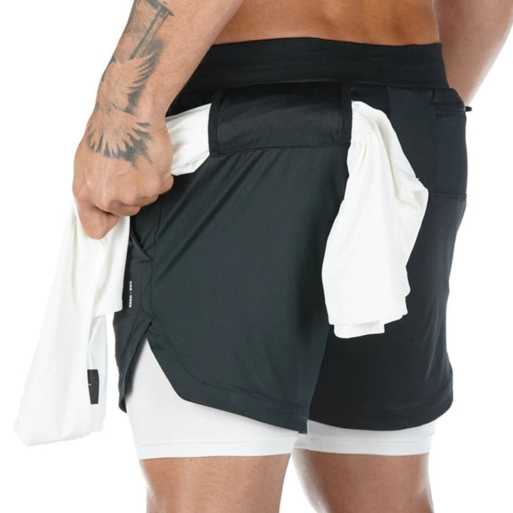 Praktische heren hardloopbroek met telefoonzak en shirtlus. Houd je handen vrij tijdens het sporten.