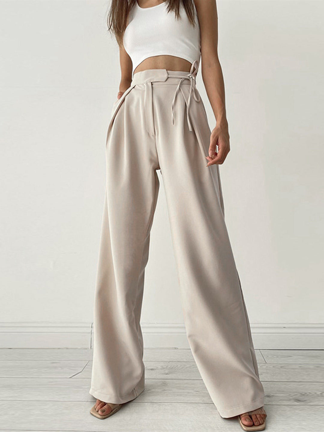 Dames high waist pantalon met wijde pijpen en elegante taille strik, ideaal voor een moderne look.