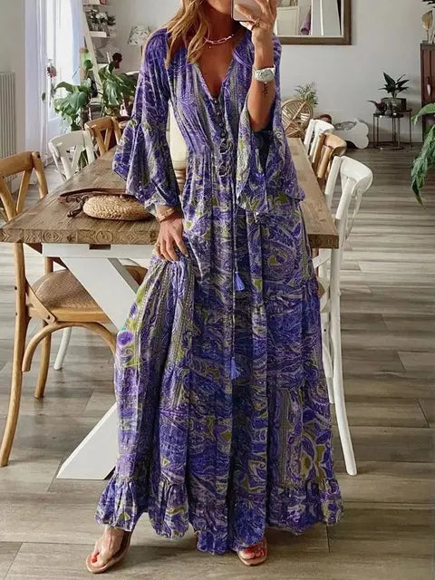 Zwierige dames maxi jurk met bloemenprint en wijde mouwen, perfect voor een elegante, comfortabele bohemian look.