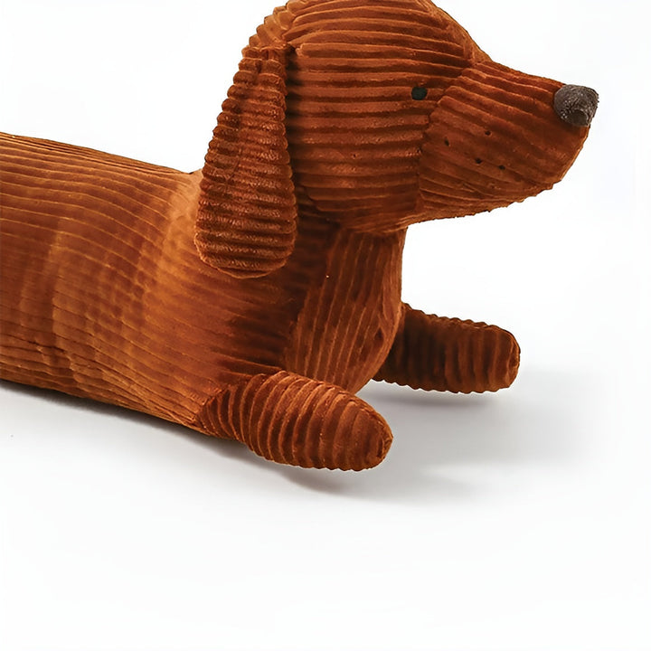 Origineel cadeau: pluche ergonomisch teckelkussen DaxiRest, een uniek sierkussen voor hondenliefhebbers.