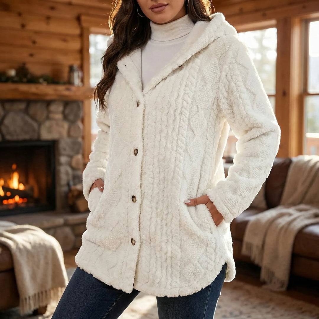 Dames pluche imitatiebont jas met capuchon en knoopsluiting. Comfortabele, warme oversized winterjas.