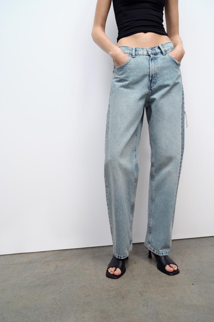 Vrouwen wideleg spijkerbroek met stijlvolle scheuren, een essentiële toevoeging aan elke garderobe.