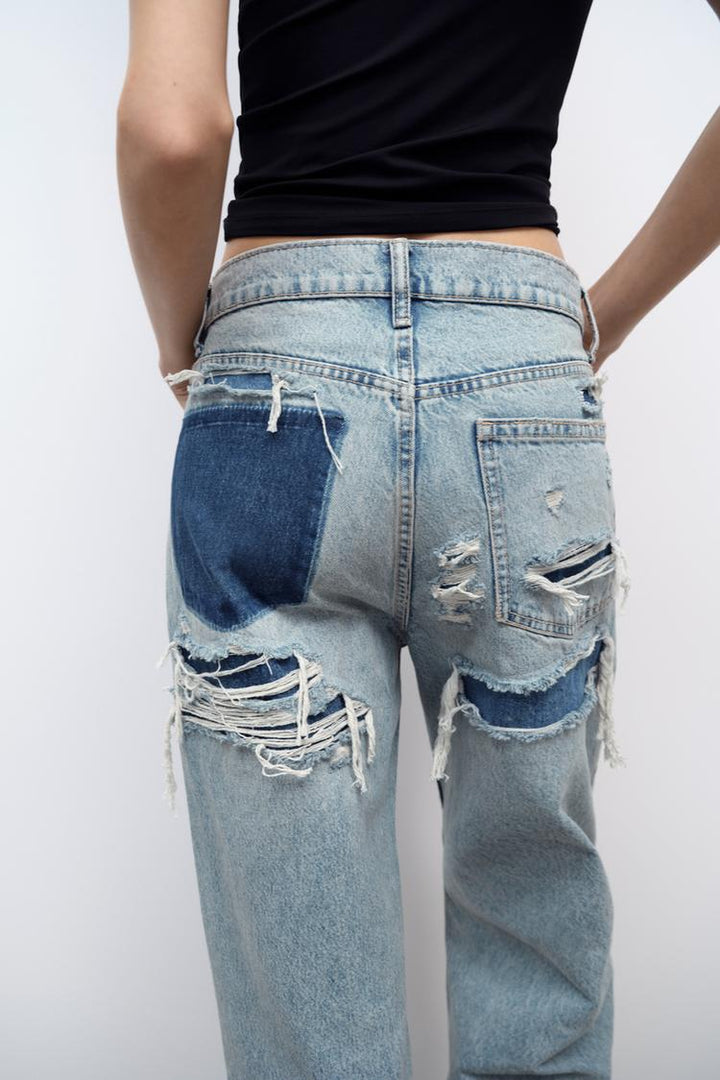 Dames wideleg ripped jeans met trendy beschadigde look, ideaal voor een casual outfit.