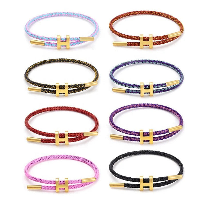 Stijlvolle touw armband met gevlochten design en unieke H-sluiting; perfect unisex accessoire.