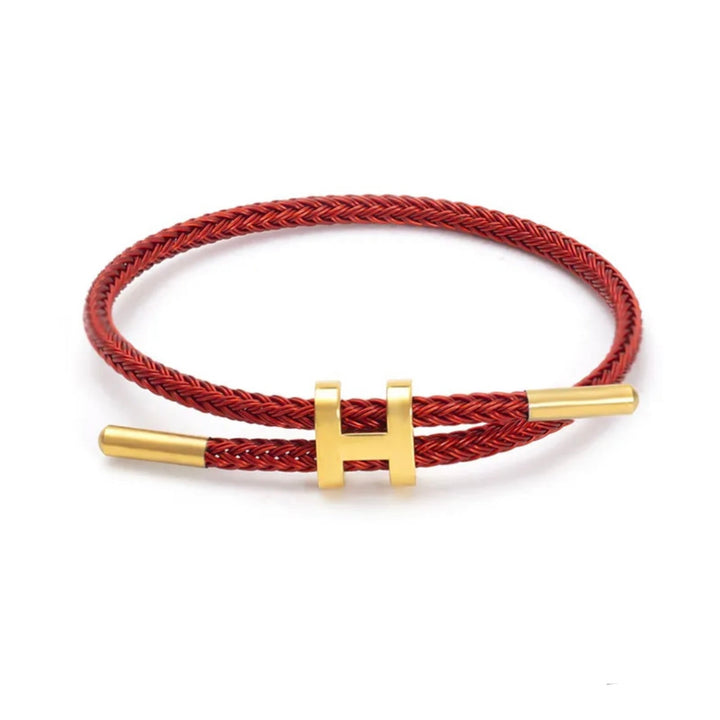 Modern unisex sieraad: gevlochten touw armband met robuuste H-sluiting voor dagelijks gebruik.
