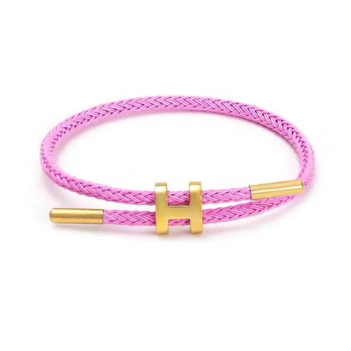 Elegant gevlochten touw armband voor dames en heren, voorzien van een chique H-sluiting.
