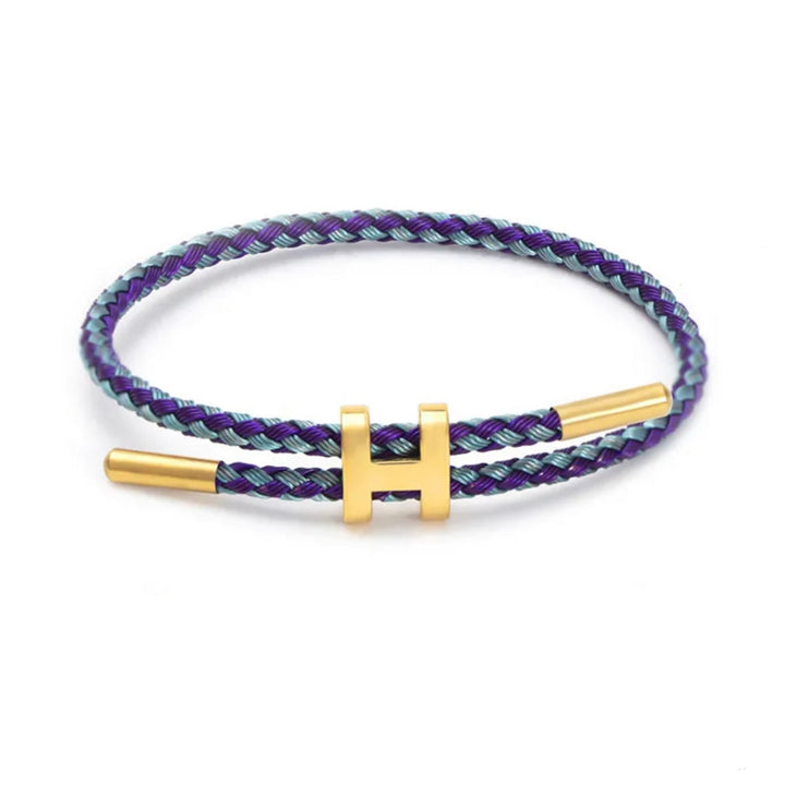Gevlochten touw armband in diverse kleuren, elegant afgewerkt met een moderne H-sluiting, unisex.