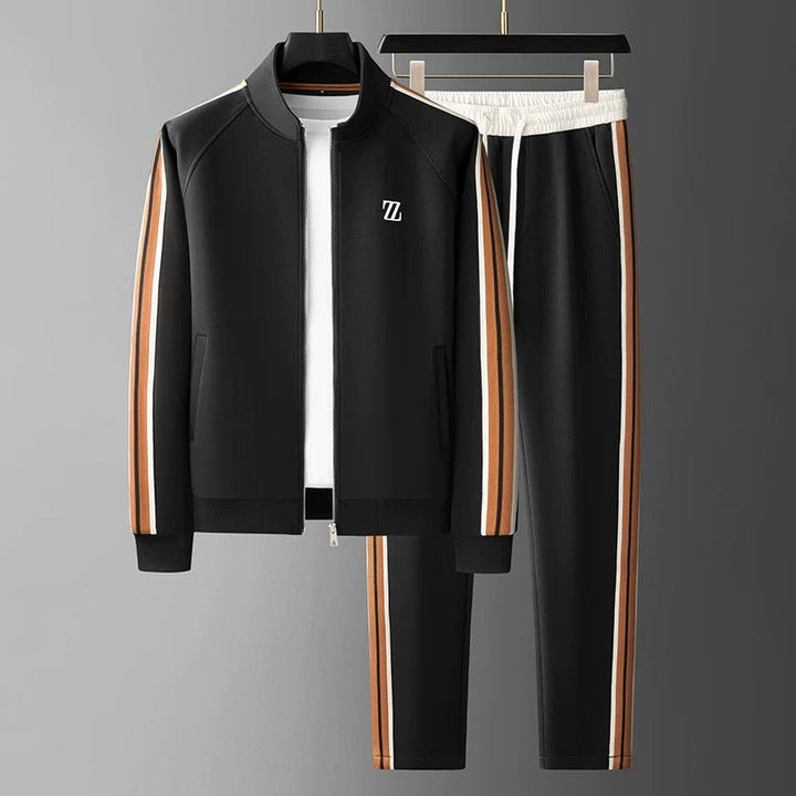 Compleet heren trainingspak, bestaande uit jasje en broek, voor een gecoördineerde athleisure outfit.