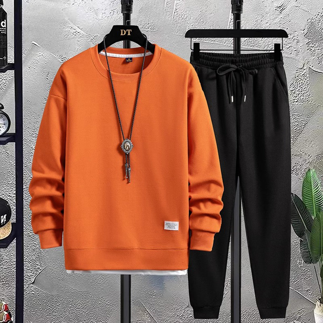 Casual tweeledig heren joggingpak, perfect voor ontspanning en sportieve vrijetijdskleding.
