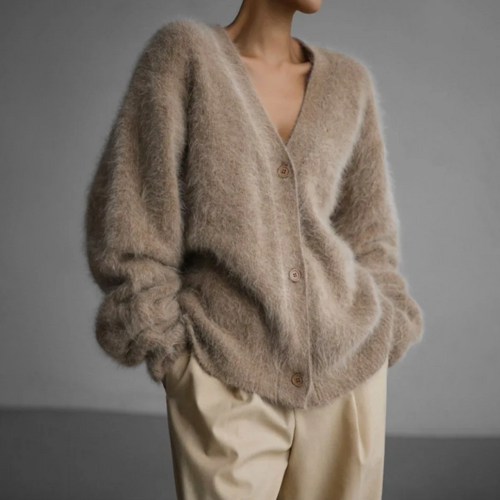 Veelzijdig dames gebreid vest, ideaal als trui of cardigan. Perfect voor elke elegante gelegenheid.