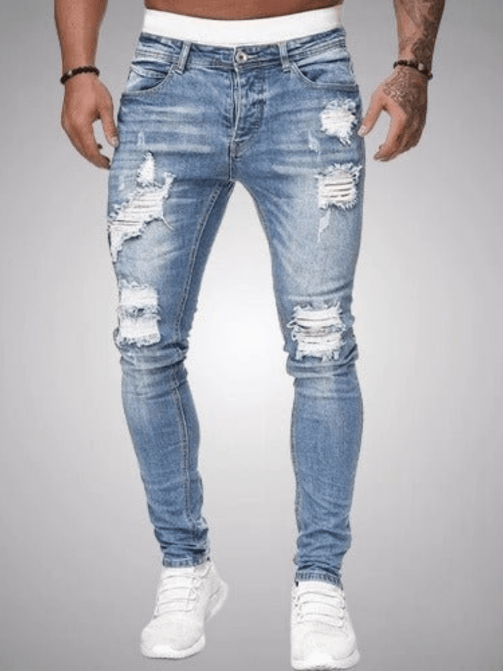 Donkere slim fit heren jeans met distressed denim en strategisch geplaatste scheuren; comfortabel en stijlvol.
