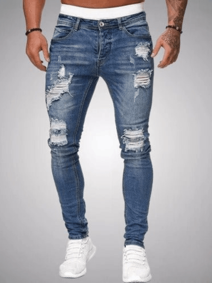 Moderne heren ripped jeans in slim fit pasvorm, perfect voor een casual look. Trendy distressed spijkerbroek.