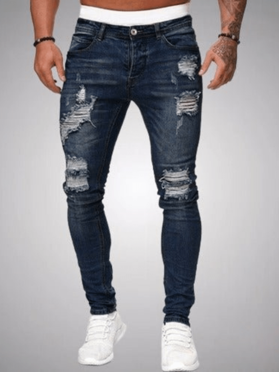 Stoere slim fit heren jeans met opvallende ripped details; een trendy spijkerbroek voor moderne herenmode.