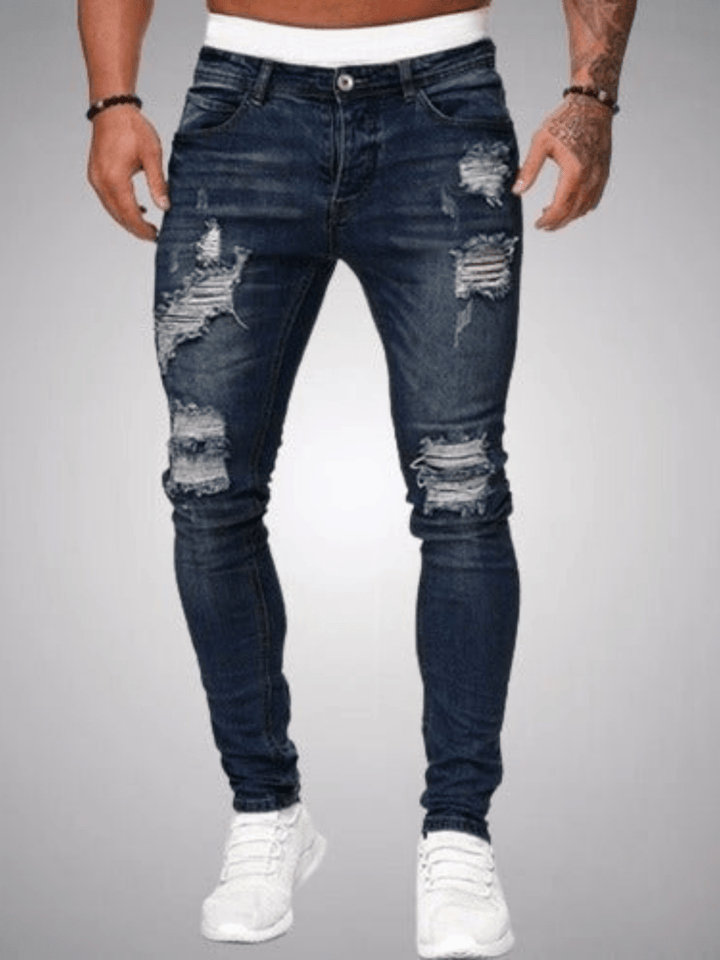 Stoere slim fit heren jeans met opvallende ripped details; een trendy spijkerbroek voor moderne herenmode.
