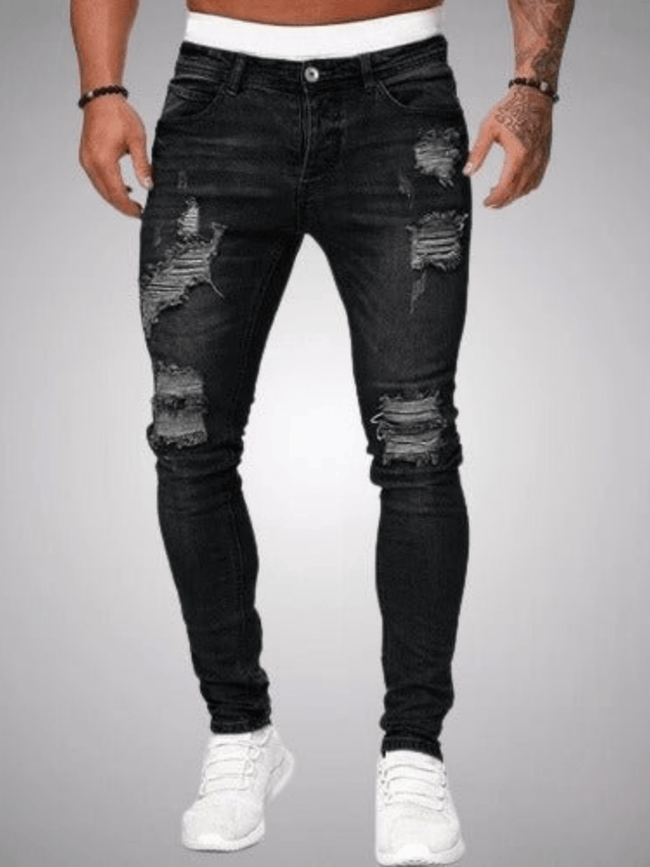 Heren slim fit jeans met stoere ripped details, trendy spijkerbroek voor een moderne streetwear look.