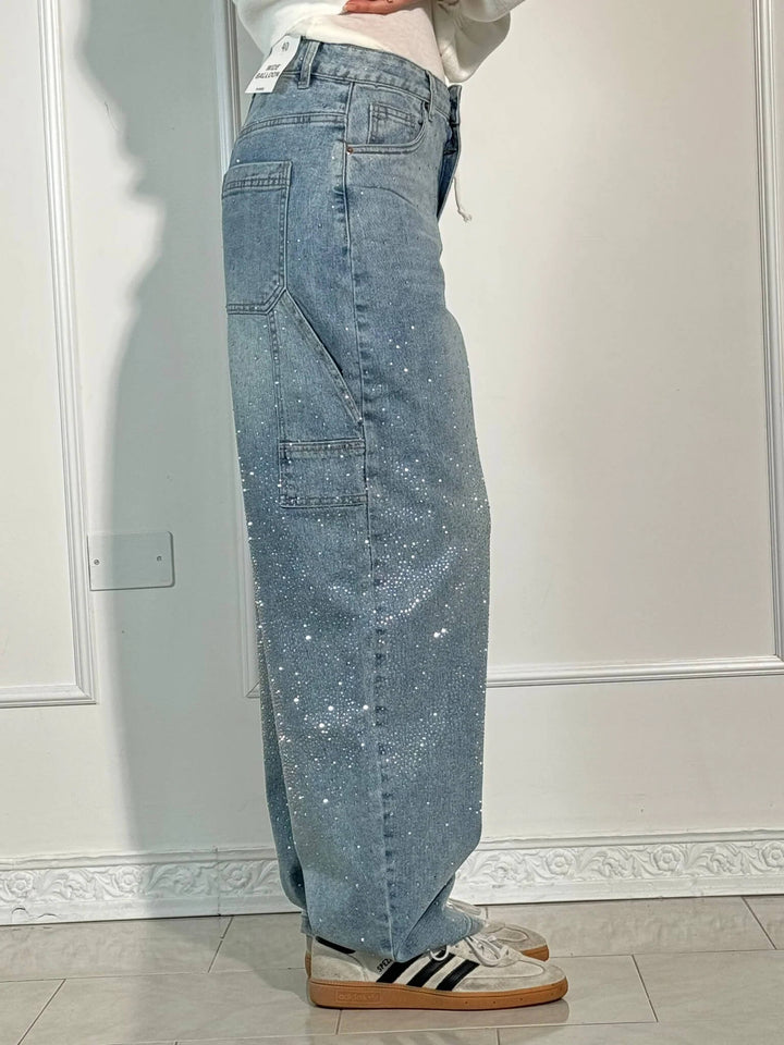 Moderne dames wide leg jeans met glanzende strassteentjes. Een echte eyecatcher.