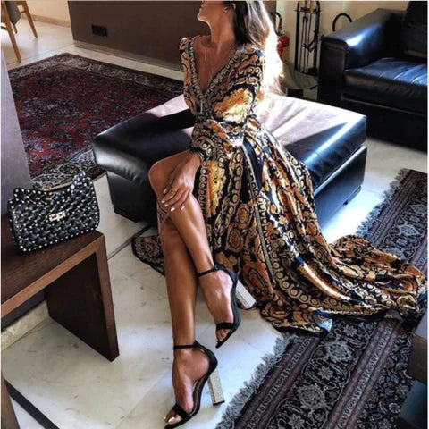 Lange dames wikkeljurk met split en v-hals. Zomerse boho maxi jurk met lange mouwen, perfect voor strand of feest.