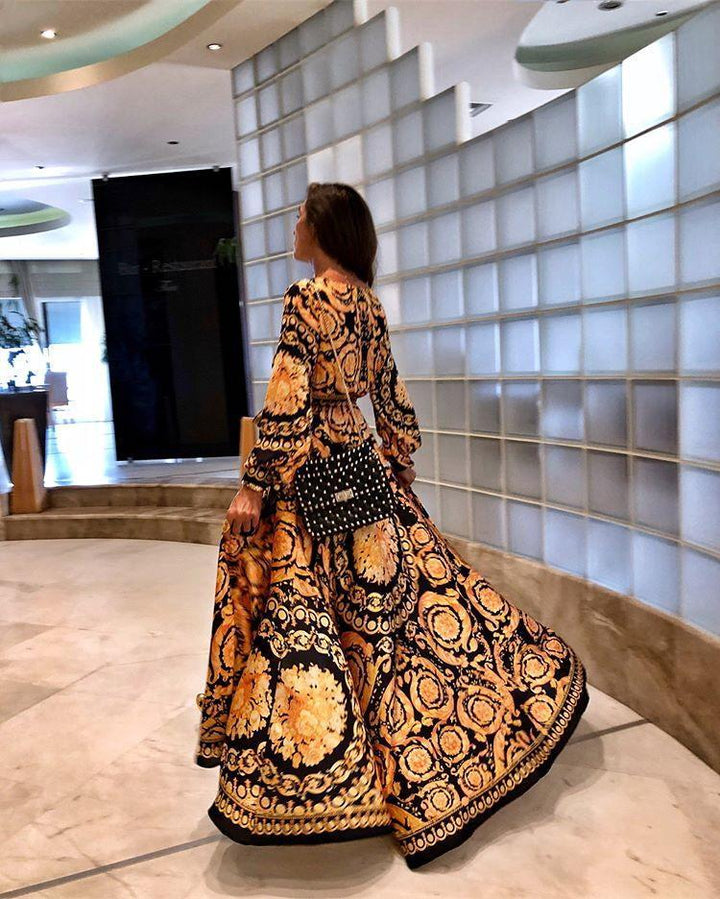 Oranje dames wikkeljurk, zomerse party jurk met split. Elegante boho maxi jurk met v-hals en lange mouwen.