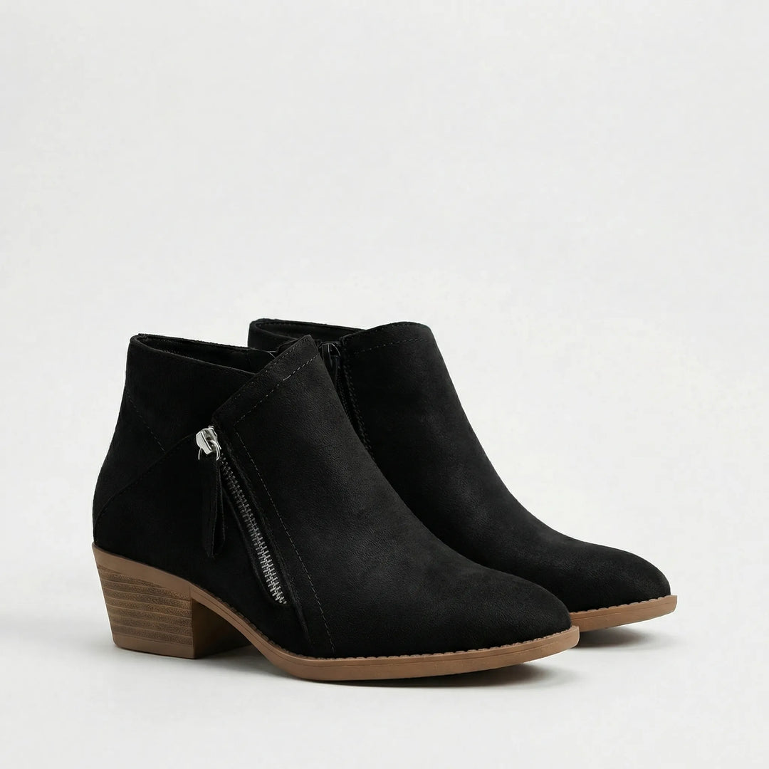 Elegante Freya dames enkellaarsjes met stabiele blokhak, bieden comfort en antislip grip voor herfst- en winterdagen.