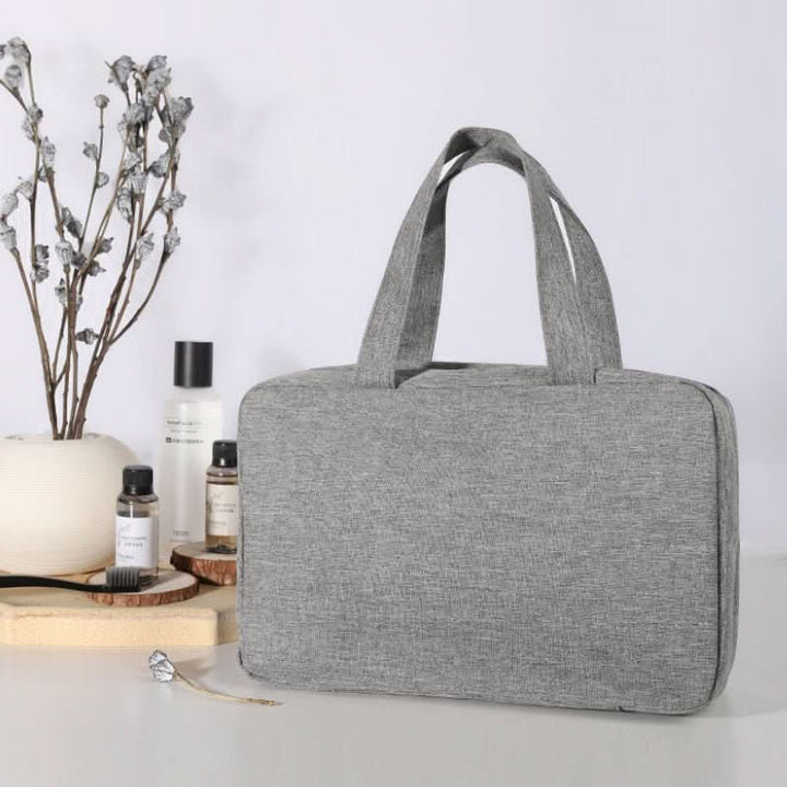 Opvouwbare reis organizer met ritsvakken; perfect voor make-up en toiletartikelen.