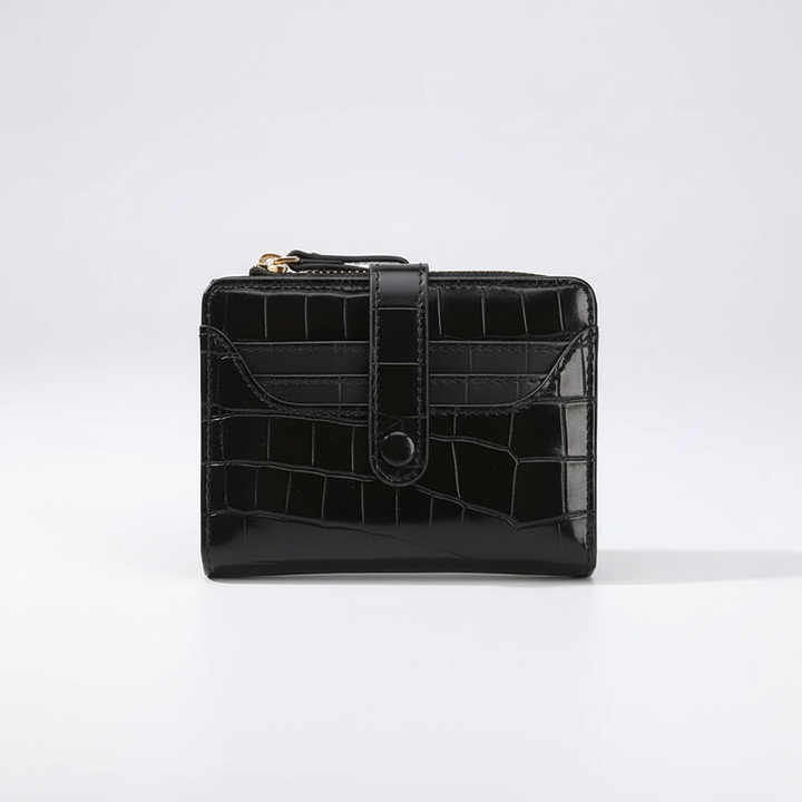 Elegante PVC damesportemonnee met sprankelende pailletten en compact design. Perfect modeaccessoire.