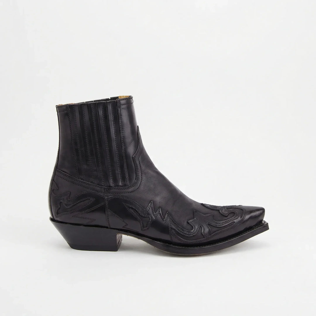 Bruine dames westernlaarzen korte schacht, met elegant stiksel. Comfortabele enkellaarzen voor elke dag.