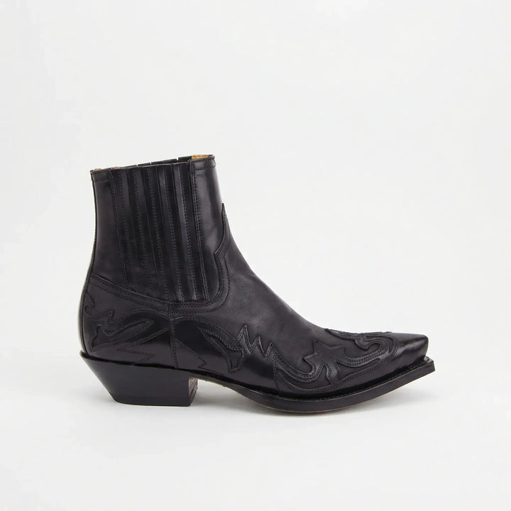 Bruine dames westernlaarzen korte schacht, met elegant stiksel. Comfortabele enkellaarzen voor elke dag.