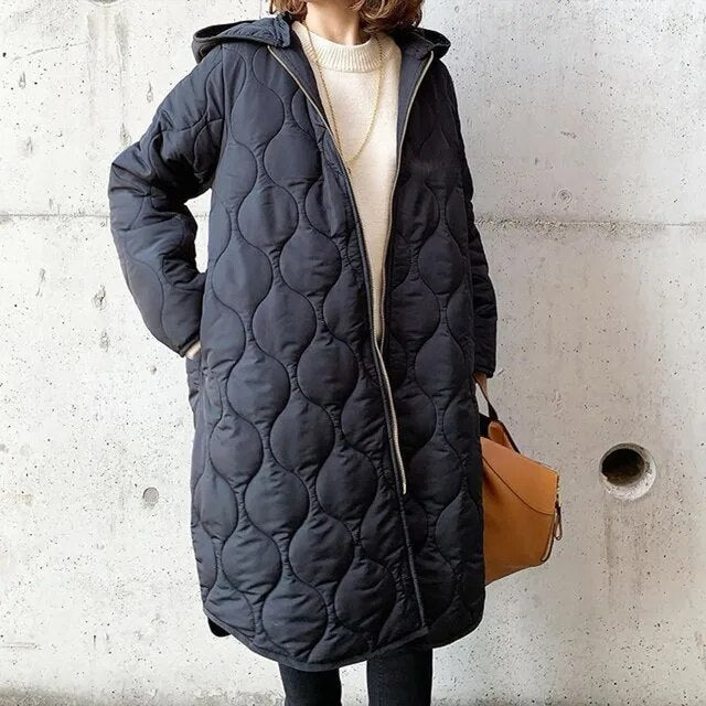 Nieuwe collectie: lange dames winterjas met capuchon. Comfortabel, warm en stijlvol voor de winter.