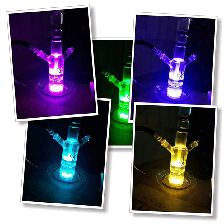Feestelijke draagbare LED sfeerlampen versieren een buitenruimte met dynamische kleuren.