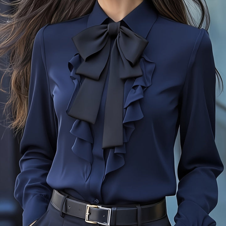 Dames blouse, lange mouwen, met elegant strikdetail. Geschikt voor casual chic en zakelijke outfits.