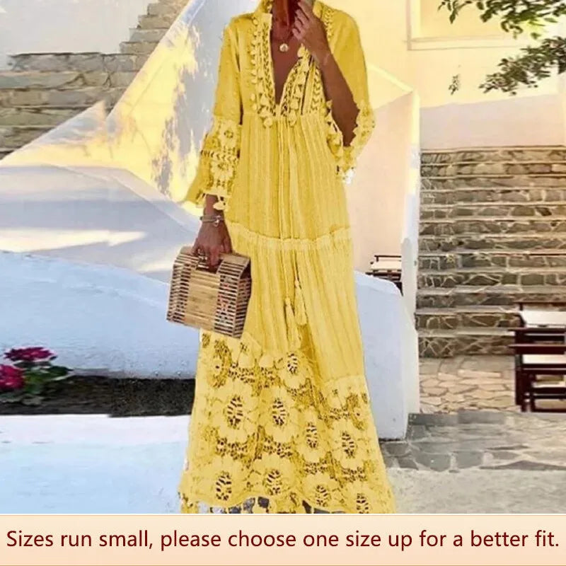 Stralende kleurrijke lange damesjurk met bohemian print, perfect voor een elegante zomerse look of vakantie.