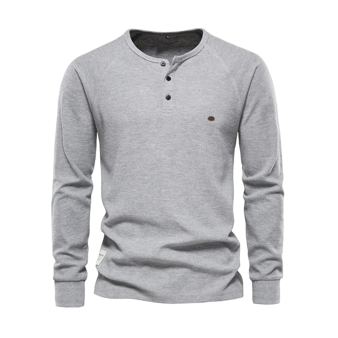 Zacht herenshirt met lange mouwen en ronde hals, perfect voor dagelijks comfort. Essentiële heren kleding.