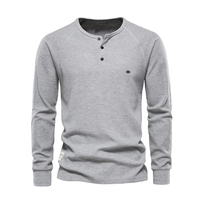 Zacht herenshirt met lange mouwen en ronde hals, perfect voor dagelijks comfort. Essentiële heren kleding.