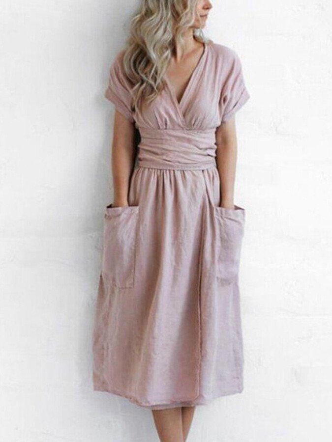 Chique dames wikkeljurk met strikceintuur. Een must-have elegante zomerjurk voor dameskleding.