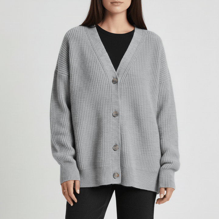 Veelzijdig losvallend damesvest met knoopsluiting. Comfortabele cardigan, stijlvol en warm voor elke look.