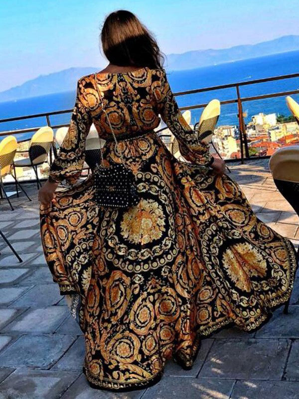 Gele dames wikkeljurk met hoge split en slangenprint. Stijlvolle v-hals maxi jurk, perfecte strandjurk.