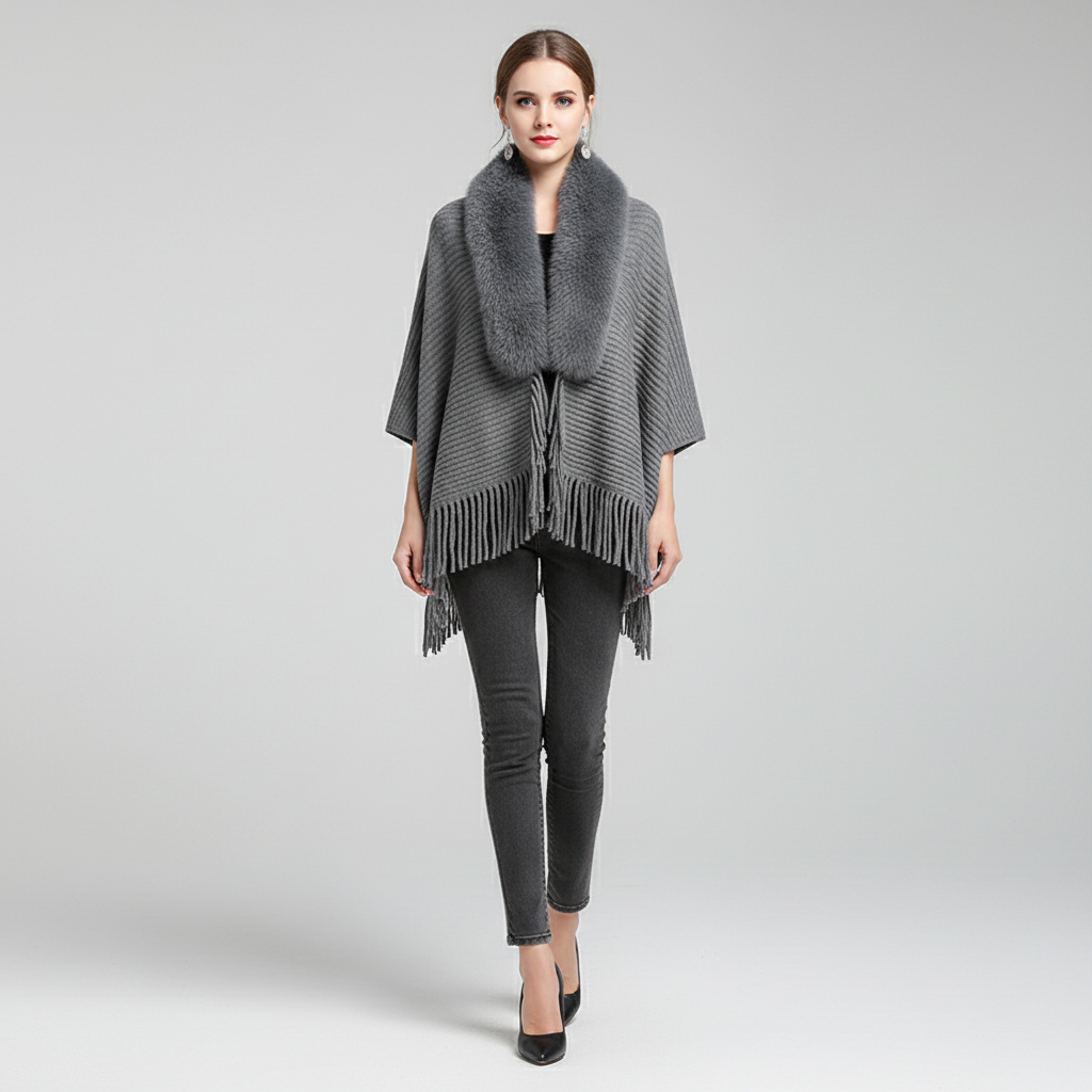 Modieuze luxe damescape: Stijlvolle en warme cape Elisa, een veelzijdig kledingstuk voor herfst en winter.
