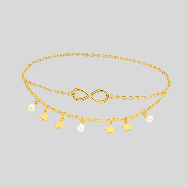 Stijlvolle goudkleurige gelaagde enkelketting voor dames met delicate sterren en glanzende parels.