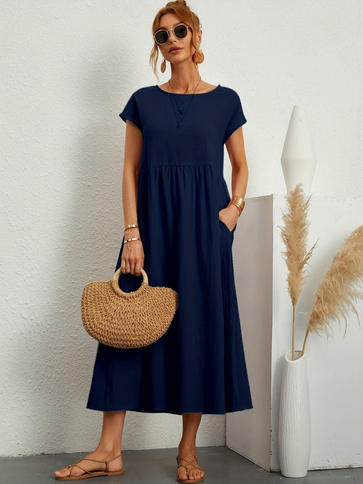 Casual dames midijurk met korte mouwen, perfect als comfortabele zomerjurk voor elegante stijl.