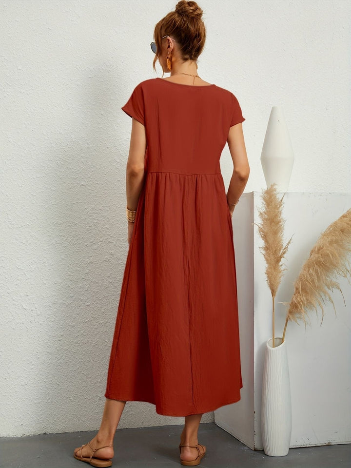 Zomerse damesjurk midi, korte mouwen, ademende stof, perfect voor een casual en comfortabele look.