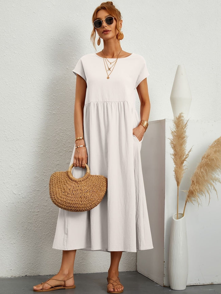 Damesjurk midi met korte mouwen, A-lijn model, comfortabel en modieus voor zomerse dagen.