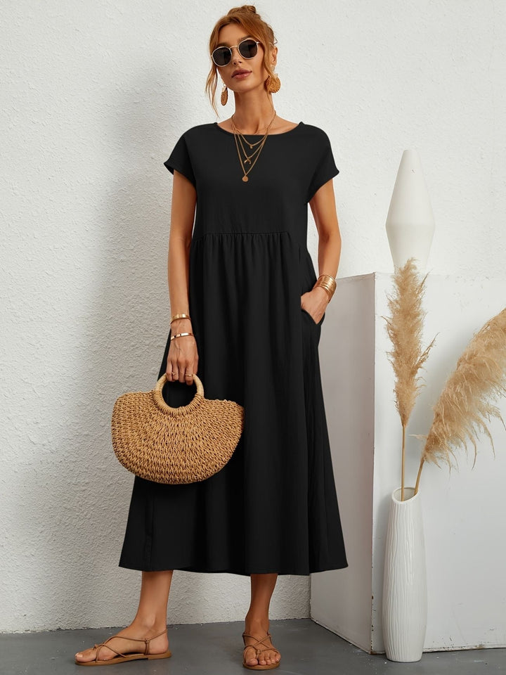 Elegante zomerjurk voor dames, midi lengte, korte mouwen, comfortabel en veelzijdig voor elke setting.
