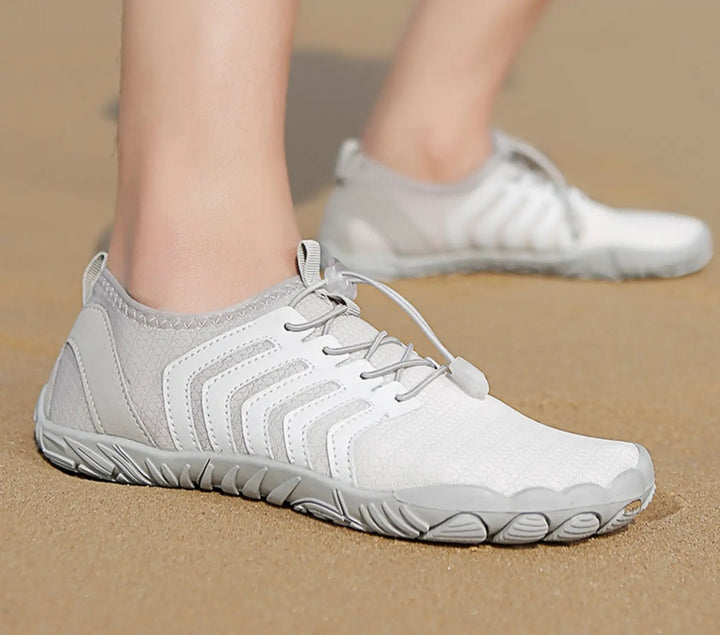 Natuurlijk lopen met Jett unisex sportschoenen. Barefoot, lichtgewicht en ademend voor buitenactiviteiten.
