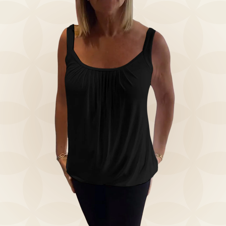 Heerlijke lentemode: mouwloze dames top met relaxte pasvorm en chique geplooide U-hals.