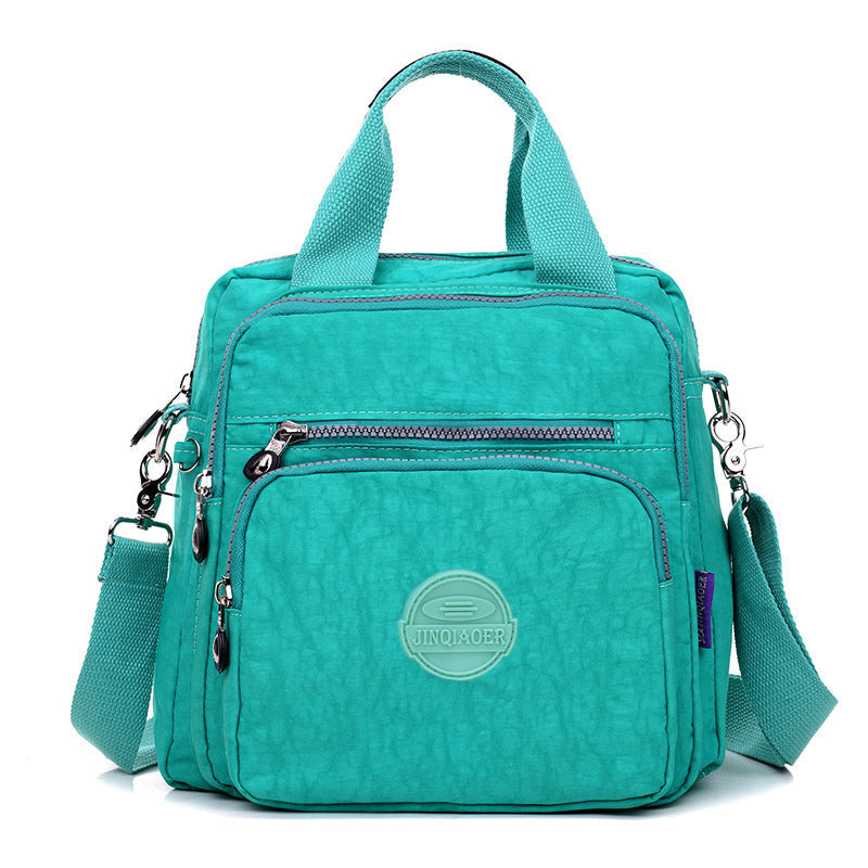 Stijlvolle en waterdichte damestas met organizer, perfect als dagelijkse crossbody of kleine rugzak.
