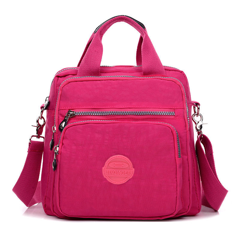 Multifunctionele rugzak-crossbody tas voor dames, waterdicht en stijlvol, met slimme opbergruimte.
